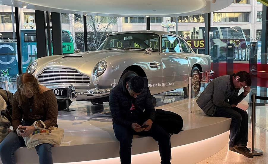 A 1964 Aston Martin DB5 is parked inside the lobby of the spy museum