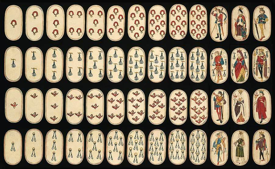 The complete deck of the Cloisters playing cards, spread out and organized by suit and value